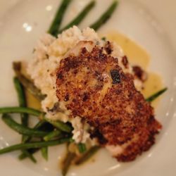 Mud Bugs A Cajun Joint - Andouille crusted redfish over a truffle mushroom risotto.