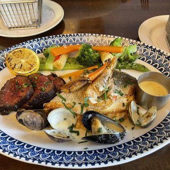 Maison Pucha Bistro - Steak frites with Branzino, crab, shrimp, Clams and mussels paired with a beurre-blanc sauce Their version of the "surf and turf"! - French Near Me - Houston, Texas Maison Pucha Bistro - Steak frites with Branzino, crab, shrimp, Clams and mussels paired with a beurre-blanc sauce Their version of the "surf and turf"! - French Near Me - Houston, Texas