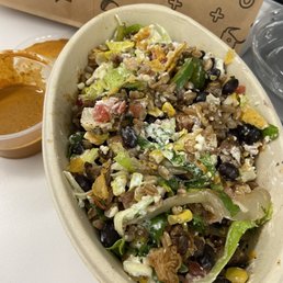 Steak burrito bowl mixed with (do not recommend) creamy mole sauce on the side Steak burrito bowl mixed with (do not recommend) creamy mole sauce on the side