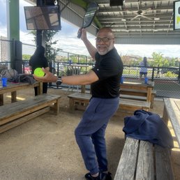 Julio warming up for pickle ball Julio warming up for pickle ball