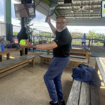 Chicken N Pickle - Julio warming up for pickle ball - American Near Me - Overland Park, Kansas Chicken N Pickle - Julio warming up for pickle ball - American Near Me - Overland Park, Kansas