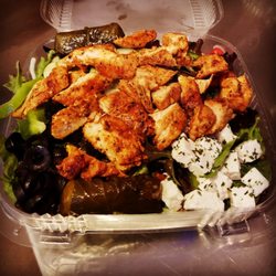 Gino's Pizza and Grill - Greek chicken salad. Fresh homemade pita and dressing on the side