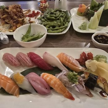 Ahi Sushi - Salmon dance left top, garlic damage top middle, cucumber rolled sushi roll(forgot name) on right top, sushi set on bottom. - Sushi Bars Near Me - Bakersfield, California Ahi Sushi - Salmon dance left top, garlic damage top middle, cucumber rolled sushi roll(forgot name) on right top, sushi set on bottom. - Sushi Bars Near Me - Bakersfield, California