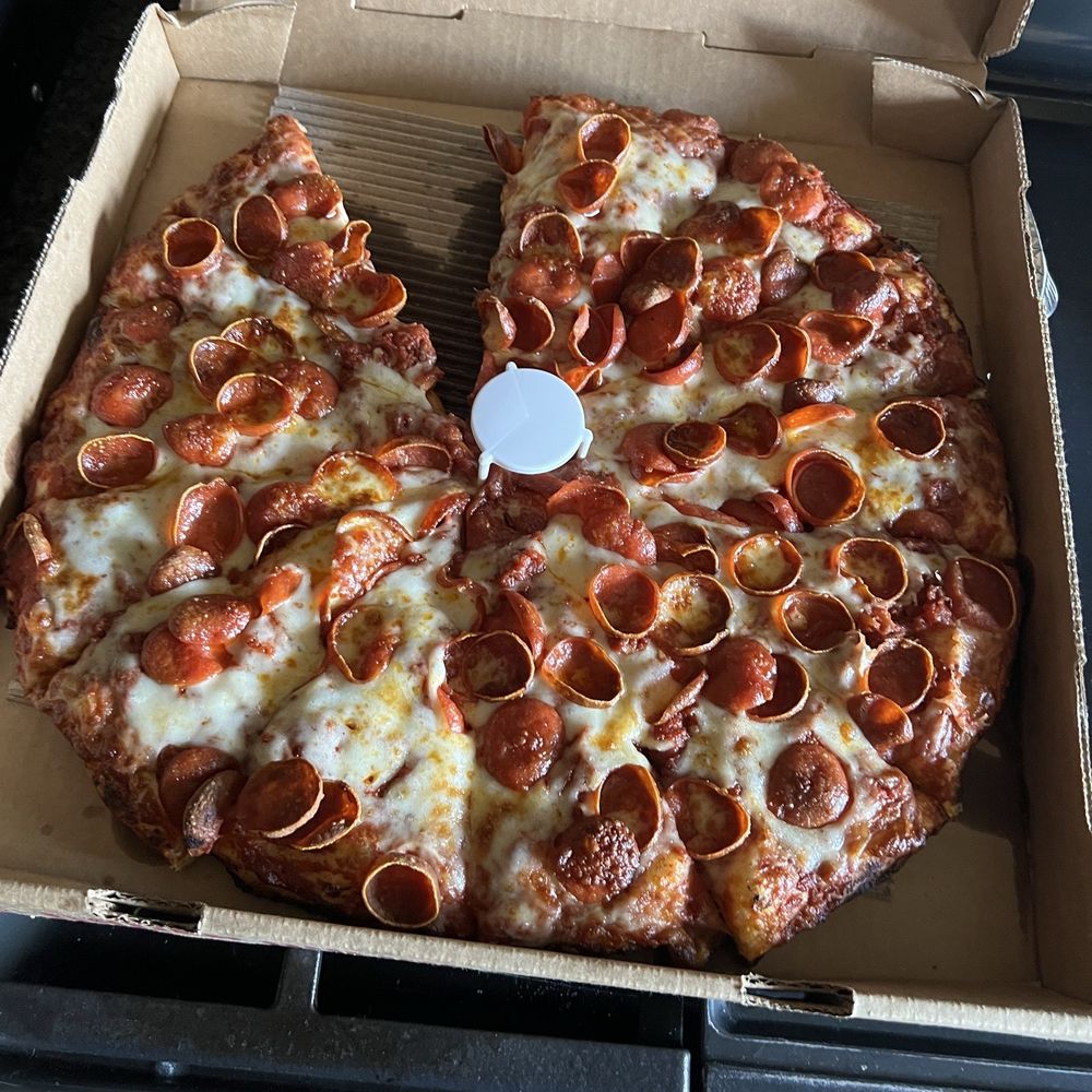 Had to have a piece before I took a pic! It was excellent, the box look a little greasy but the pizza was perfectly cooked!