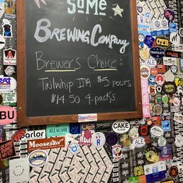 a chalkboard with a sign on it a chalkboard with a sign on it