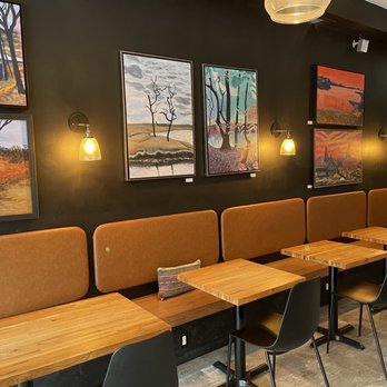 Two Mile Coffee Bar - a row of tables and chairs - Coffee & Tea Near Me - Chicago, Illinois