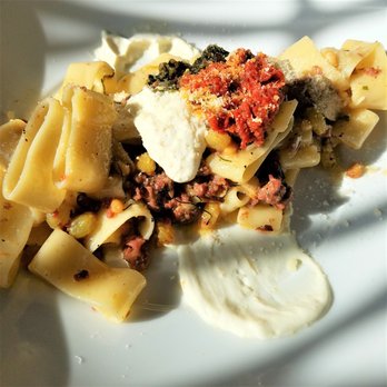 Nesso - 19-5 Primi - Calamarata (lamb sausage. Calabrian chile, labneh, pesto, oil-cured tomato) - Italian Near Me - Indianapolis, Indiana Nesso - 19-5 Primi - Calamarata (lamb sausage. Calabrian chile, labneh, pesto, oil-cured tomato) - Italian Near Me - Indianapolis, Indiana