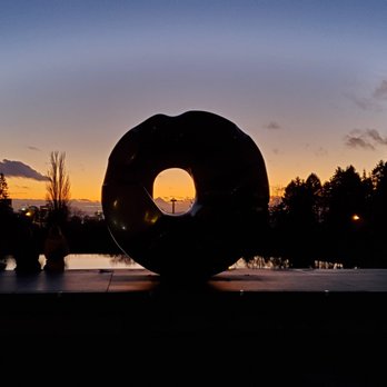 Seattle Asian Art Museum - Space Needle through the "Black Sun" by Isamu Noguchi - Art Museums Near Me - Seattle, Washington