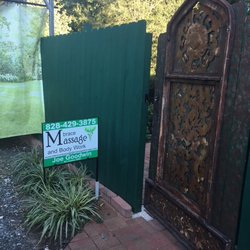 Mbrace Massage and Body Work - Gated entrance to garden area and entrance to Mbrace Massage.