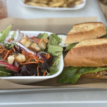 Freeman's Grub & Pub - Brisket sandwich with a Small House salad - New American Near Me - Greensboro, North Carolina