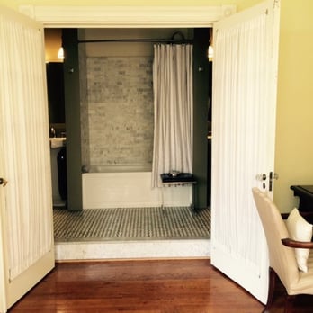 The Morgan State House Inn - Relaxing bathroom with tile detail, floor to ceiling built-ins, french doors, lighting options, and a jetted tub. - Hotels Near Me - Albany, New York The Morgan State House Inn - Relaxing bathroom with tile detail, floor to ceiling built-ins, french doors, lighting options, and a jetted tub. - Hotels Near Me - Albany, New York