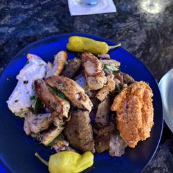 New Angelina's bowl. Opted for lamb and added chicken. It has spicy feta and tzatziki dips, rice, and Greek salad. Very good!