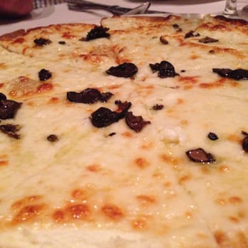 Timo - Black and white pizza: fresh ricotta, mozzarella, provolone with shaved truffles - Italian Near Me - Sunny Isles Beach, Florida Timo - Black and white pizza: fresh ricotta, mozzarella, provolone with shaved truffles - Italian Near Me - Sunny Isles Beach, Florida