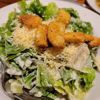 Johnny Carino's - Caesar salad with added parmesan - Italian Near Me - Albany, Oregon Johnny Carino's - Caesar salad with added parmesan - Italian Near Me - Albany, Oregon