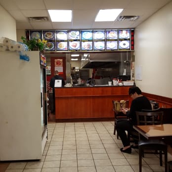 Panda Garden - a woman sitting at a table in a restaurant - Chinese Near Me - Bellbrook, Ohio