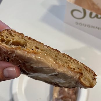 Sidecar Doughnuts & Coffee - Apple fritter cut in half, very dense and flat. Not the way it normally looks. - Donuts Near Me - Costa Mesa, California