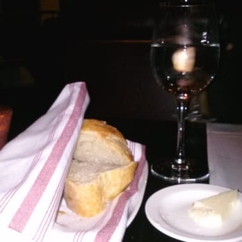 Bistro Niko - Getting started with a bit of bread & wine. - French Near Me - Atlanta, Georgia