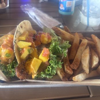 Molly's Beachside Bar & Grill - Sheep's head taco special with mango salsa and Cajun fries - American Near Me - Atlantic Beach, North Carolina Molly's Beachside Bar & Grill - Sheep's head taco special with mango salsa and Cajun fries - American Near Me - Atlantic Beach, North Carolina