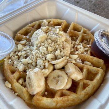 Kihei Caffe Lahaina - Belgian waffle with bananas and macadamia nuts with a side of syrup and melted butter - Breakfast & Brunch Near Me - Lahaina, Hawaii