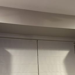 Photo of shelves holding bookshelf speakers.