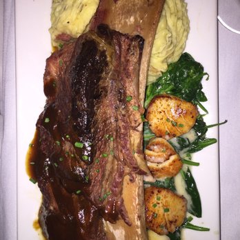 Garvan's Gastropub - Surf and Turf... scallops on spinach with one huge short rib and mashed potatoes - Gastropubs Near Me - New Paltz, New York Garvan's Gastropub - Surf and Turf... scallops on spinach with one huge short rib and mashed potatoes - Gastropubs Near Me - New Paltz, New York