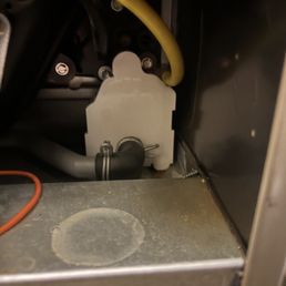 Area where condensation flowed into electrical control panel area from hole drilled into PVC pipe by tech in next picture