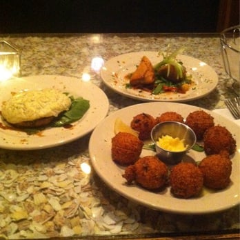 Catch 22 - Seafood huppies, prawn spring roll, and seafood stuffed portabella - Seafood Near Me - Hilton Head Island, South Carolina Catch 22 - Seafood huppies, prawn spring roll, and seafood stuffed portabella - Seafood Near Me - Hilton Head Island, South Carolina