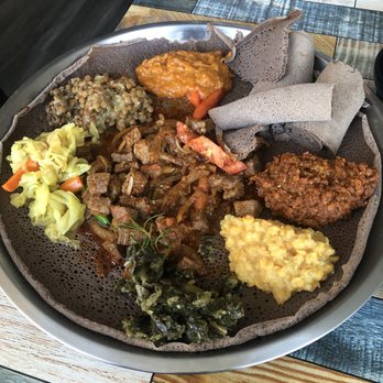 Lucy Ethiopian Restaurant - Vegan platter with Awaze Tibs in the center. Super good. - Ethiopian Near Me - San Diego, California Lucy Ethiopian Restaurant - Vegan platter with Awaze Tibs in the center. Super good. - Ethiopian Near Me - San Diego, California