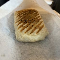 Station Coffee Bar & Bistro - A bacon breakfast burrito. He ordered two because they were pretty small.