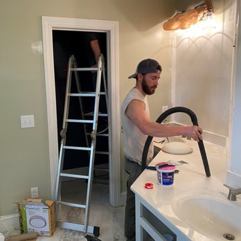 Speer Built Construction - a man fixing a sink - General Contractors Near Me Speer Built Construction - a man fixing a sink - General Contractors Near Me