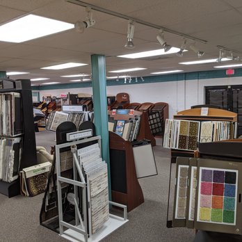 Carpet & Rug Superstore - a woman in a store - Carpeting Near Me - Matthews, North Carolina