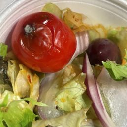a salad in a plastic container