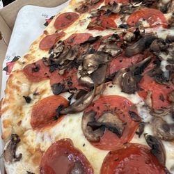 Alton Village Pizza - Large pepperoni and mushroom pizza. 20$ after tax. Delicious. Mushrooms were paper thin, yum!
