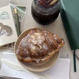 Delicious almond croissant and my iced Americano. :)