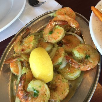 Rayan - a plate of shrimp and potatoes with a lemon - Seafood Near Me - Montreal, Quebec