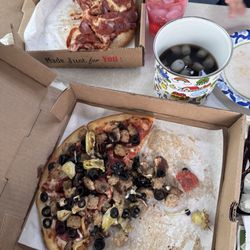 Calico's - Pepperoni and Combo Meat with Artichokes. (Sorry about picture. Family got to it before I could take a picture of whole pizzas.)