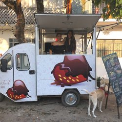 ChocoFruit Joublanc - The sisters in their lovely little truck, in front of their cafe at Costa Rica 1382, 5 de Diciembre. That's Choca out front, the rescue dog)