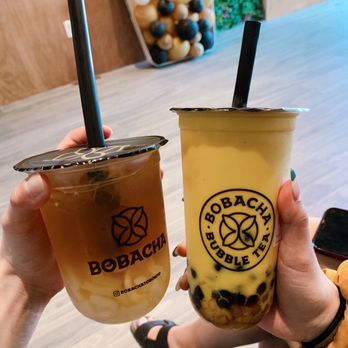 Bobacha - two people holding up drinks - Bubble Tea Near Me - Toronto, Ontario Bobacha - two people holding up drinks - Bubble Tea Near Me - Toronto, Ontario