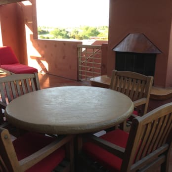 Hilton Grand Vacations Club Palm Desert - Seating on the patio near the fireplace - Hotels Near Me - Palm Desert, California Hilton Grand Vacations Club Palm Desert - Seating on the patio near the fireplace - Hotels Near Me - Palm Desert, California