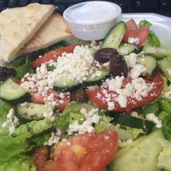 Crest Cafe - Huge side salad with pita and garlic dipping sauce. Viniagrette dressing is yummy too! - Greek Near Me - Sacramento, California