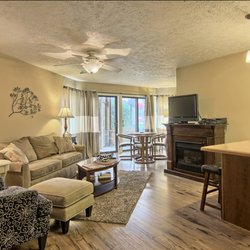 Living room with hardwood flooring, queen size pull-out sleeper sofa.