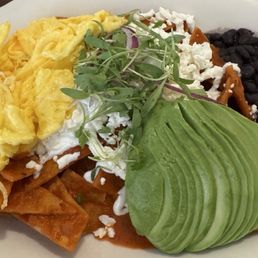 Chilaquiles with eggs and avocado