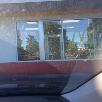 McDonald's - the reflection of a mcdonald's sign in the window - Fast Food Near Me - Danvers, Massachusetts