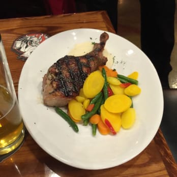 The District Tap - Double cut pork chop - Sports Bars Near Me - Indianapolis, Indiana