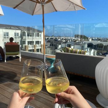 Topside Roof Deck - Glasses of the Chardonnay with a view of the roof top deck - Cocktail Bars Near Me - Newport Beach, California