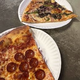 Pepperoni pizza and veggie pizza slices Pepperoni pizza and veggie pizza slices