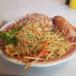 Singapore Noodles, fried rice and an egg roll Singapore Noodles, fried rice and an egg roll