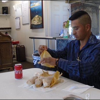 La Bamba - This gentleman appears to hungry, as he is unwrapping from the corn husk his first, of four, tamales. - Mexican Near Me - Roseville, California La Bamba - This gentleman appears to hungry, as he is unwrapping from the corn husk his first, of four, tamales. - Mexican Near Me - Roseville, California