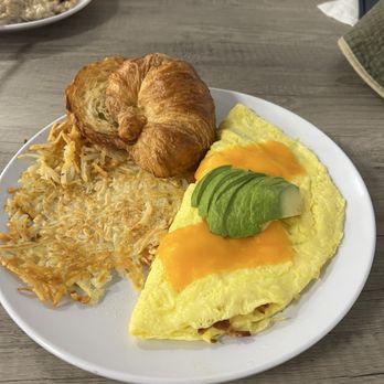 Pavilion Grill - ABC (avocado, bacon, cheddar) omelette with hash browns, and croissant. - Coffee & Tea Near Me - Sun City West, Arizona Pavilion Grill - ABC (avocado, bacon, cheddar) omelette with hash browns, and croissant. - Coffee & Tea Near Me - Sun City West, Arizona