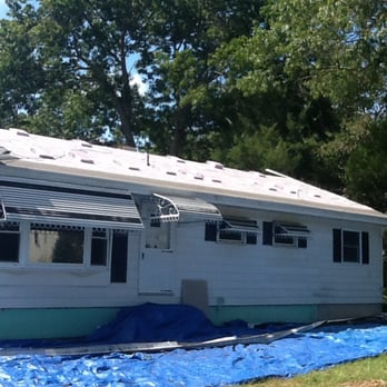 Lagunes Home Remodeling - a man on the roof - Roofing Near Me Lagunes Home Remodeling - a man on the roof - Roofing Near Me